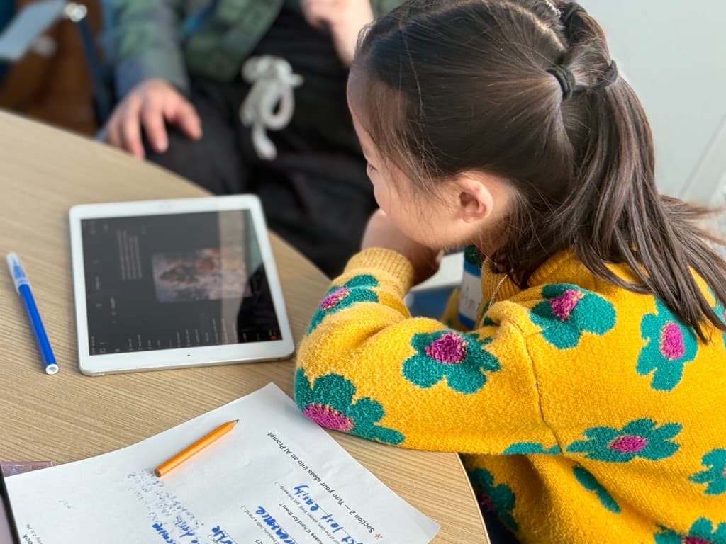 Instructor helping students at the table during Storybook
