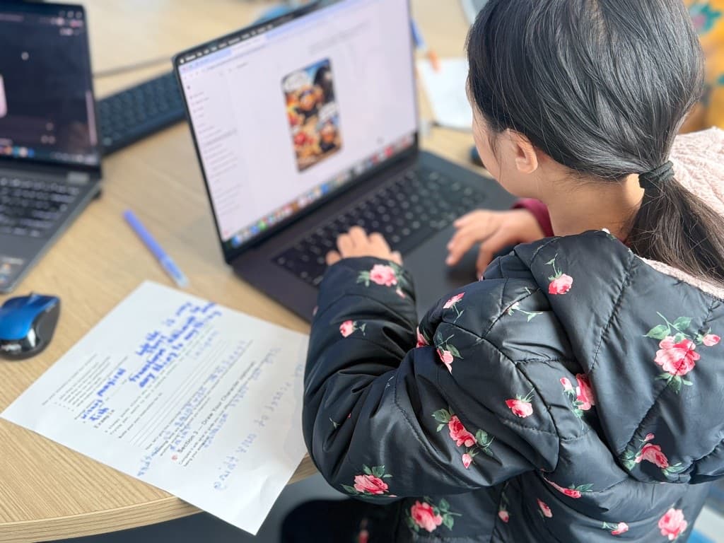 Student showcasing an AI-illustrated comic page from their story